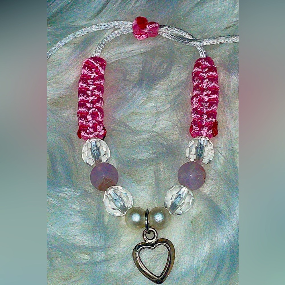 Pink hearted bracelet can change size to yours with bracelet string